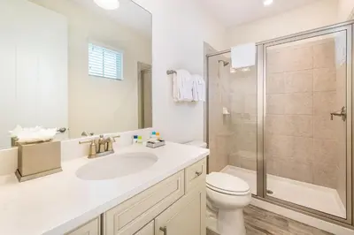 a bathroom with a toilet sink and a shower at Love, Luck And Magic Cottage With Private Hot Tub Near Disney And Margaritaville Resort & Island H2O Access - 8013Ff in Orlando