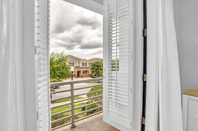 a door to a balcony with a view at 650 Lasso Drive in Orlando