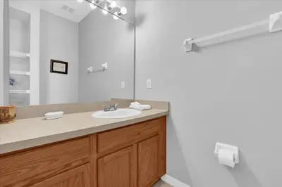 a bathroom with a sink and a mirror at Spring retreat near Disney, Perfect for families in Kissimmee