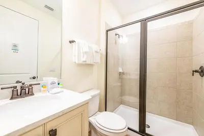 a bathroom with a shower and a toilet and a sink at Lively Cottage Near Disney With Margaritaville Resort & Island H20 Waterpark Access - 2998Sr in Orlando