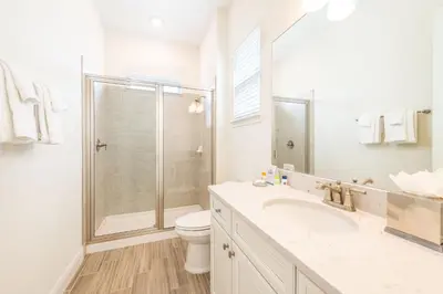 a bathroom with a shower and a toilet and a sink at Don't Worry, Beach Happy Cottage Near Disney With Private Hot Tub & Margaritaville Resort & Island H20 Waterpark Access - 3005Sp in Orlando