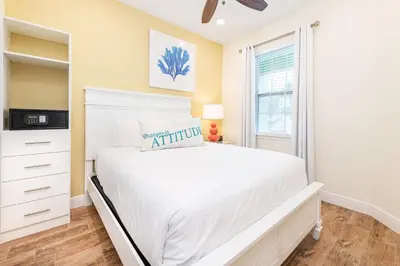 a bedroom with a white bed and a window at Toes In The Water Cottage With Private Pool Near Disney With Margaritaville Resort & Island H2O Access - 8008Sh in Orlando
