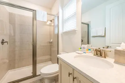 a bathroom with a toilet sink and a shower at Vivid Cottage Near Disney With Margaritaville Resort & Island H2O Access - 8024Ls in Orlando