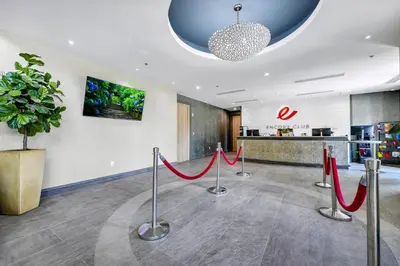 a lobby with red ribbon barriers in front of a pharmacy at Lovely Home Near Disney With Private Pool, Foosball Table And Waterpark & Resort Access At Encore Resorts Reunion - 408Sf in Kissimmee