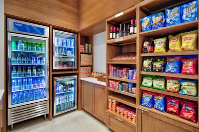 a store refrigerator filled with lots of food and drinks at Fairfield by Marriott Inn & Suites Orlando at FLAMINGO CROSSINGS® Town Center in Orlando