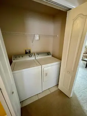 a laundry room with a washer and dryer at Grand Family Premium 3BR Condo near Disney Parks in Kissimmee