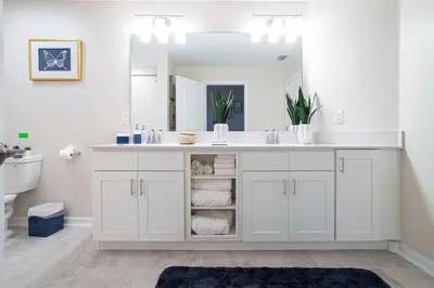 a white bathroom with a sink and a mirror at Stunning 3Bd Apto Close to Disney 201P in Kissimmee