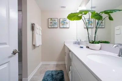 a bathroom with a sink and a mirror at Stunning 3Bd Apto Close to Disney 201P in Kissimmee