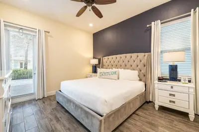 a bedroom with a bed and a ceiling fan at Comfy Cottage Near Disney With Margaritaville Resort & Island H2O Access - 8087Kd in Orlando