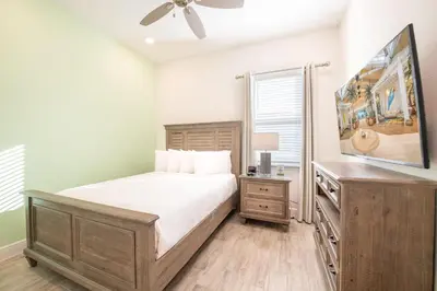 a bedroom with a bed and a ceiling fan at Brilliant Cottage Near Disney With Margaritaville Resort & Island H2O Access - 8090Kd in Orlando