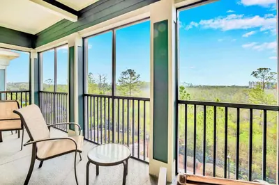 a balcony with a table and chairs and a view at Bright & Airy 3BR Suite Near Disney - Pool in Orlando