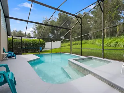 a swimming pool in a house with a glass roof at bsv_villa1607 in Orlando