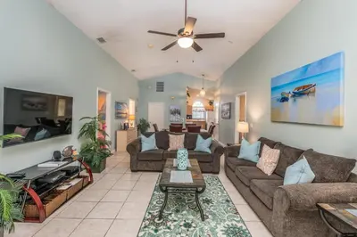 a living room with couches and a ceiling fan at bsv_villa1607 in Orlando