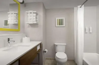 a bathroom with a white toilet and a sink at Hampton Inn & Suites Orlando North Altamonte Springs in Orlando