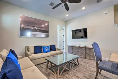 a living room with a couch and a table at Home with Hot Tub 4 Mi to Disney! in Orlando