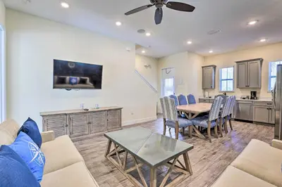 a living room with a couch and a table at Home with Hot Tub 4 Mi to Disney! in Orlando