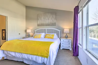 a bedroom with a large bed and a window at Private Cocktail Pool Kissimmee Resort Retreat! in Orlando