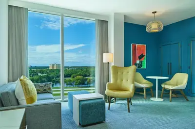 a hotel room with a view of a living room at Walt Disney World Swan Reserve in Orlando