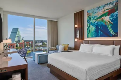 a hotel room with a bed and a large window at Walt Disney World Swan Reserve in Orlando
