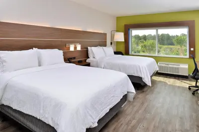 a hotel room with two beds and a window at Holiday Inn Express Orlando - South Park by IHG in Orlando