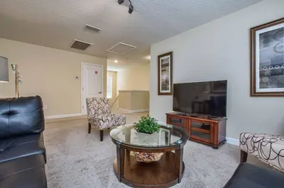 a living room with a flat screen tv and furniture at Sunny Escape, Pool, Spa, Resort-3509Pp in Kissimmee
