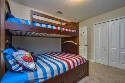 a bedroom with two bunk beds and a closet at Sunny Escape, Pool, Spa, Resort-3509Pp in Kissimmee