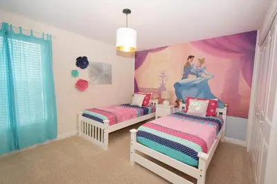 a childs bedroom with two beds and a disney mural at Luxury Pool Home, Spa, Grill- 1664St in Kissimmee