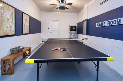 a ping pong room with a ping pong table at Luxury Pool Home, Spa, Grill- 1664St in Kissimmee