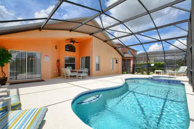an indoor swimming pool with a glass roof at Serene Pool & Spa, Gated Resort- 2201Em in Kissimmee