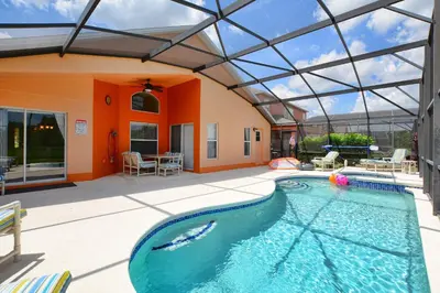 an indoor swimming pool with a glass ceiling at Serene Pool & Spa, Gated Resort- 2201Em in Kissimmee