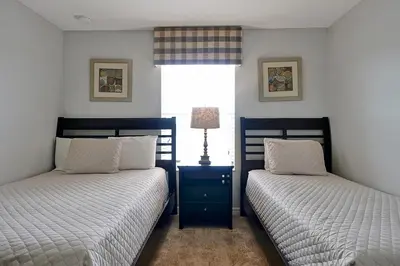 a bedroom with two beds and a window at Rare Waterfront Wspashpool, Resort -3091Pp in Kissimmee