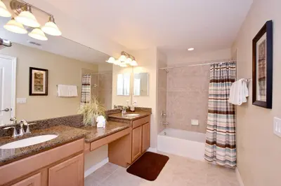 a bathroom with a sink and a tub and a shower at Paradise Palms -5 Bed Townhome W-Splashpool-3046Pp in Kissimmee