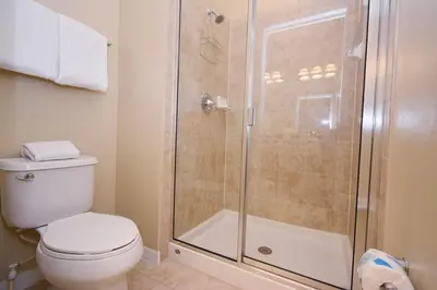 a bathroom with a toilet and a shower at Paradise Palms -5 Bed Townhome W-Splashpool-3046Pp in Kissimmee