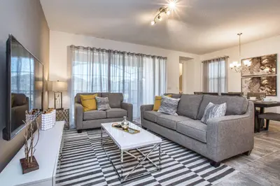 a living room with two couches and a table at 5 Bedrooms Townhome W- Splashpool - 8205Sa in Orlando
