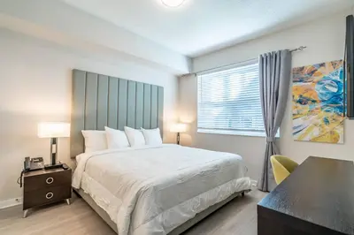 a bedroom with a large bed and a window at 4013 Vista Cay in Orlando