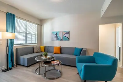 a living room with a couch and a table at 4013 Vista Cay in Orlando