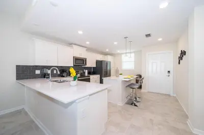 a kitchen with white cabinets and a counter top at 3180-305MN STOREY LAKE, CONDO 2/2 POOL VIEW in Kissimmee