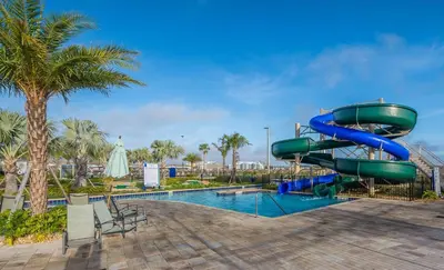 a water slide in a resort with a pool at 2825PA VILLA 5 BED/5 BA (SANITIZED) in Kissimmee