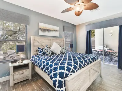 a bedroom with a bed and a ceiling fan at Ohana House at Windsor Hills, Disney World Luxury Rental in Orlando