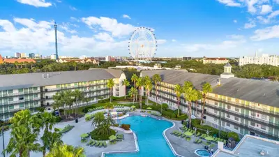 an aerial view of a resort with a pool and a ferris wheel at Avanti International Resort in Orlando
