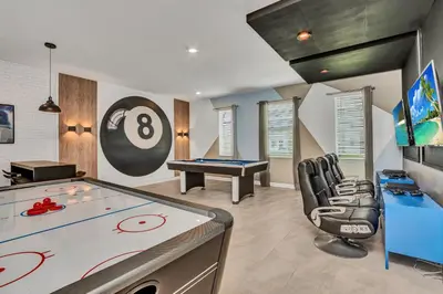 a room with a pool table and a game room at VILLA wPrivate Pool & Game Room near Disney in Kissimmee