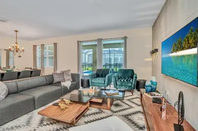 a living room with a couch and chairs at VILLA wPrivate Pool & Game Room near Disney in Kissimmee