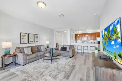 a living room with a couch and a table at 4816 Cayview Ave #306 in Orlando
