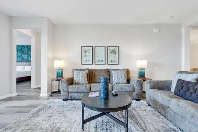 a living room with two couches and a table at 4816 Cayview Ave #306 in Orlando