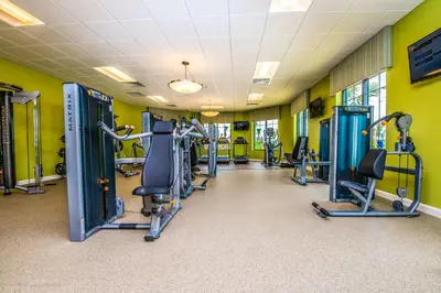 a gym with treadmills and cardio machines at 3131 Paradox Cir Unit 203 in Kissimmee