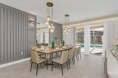 a dining room with a table and chairs at 4520 Target Blvd in Kissimmee