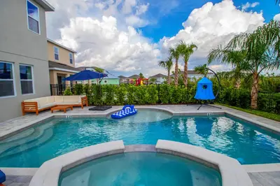 a swimming pool in the backyard of a house at Encore Resort 6 Bedroom Vacation Home with Pool (2102) in Orlando