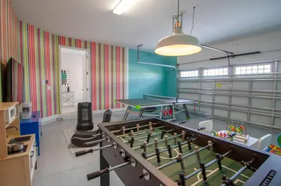 a room with a pool table and ping pong tables at Encore Resort 6 Bedroom Vacation Home with Pool (2102) in Orlando
