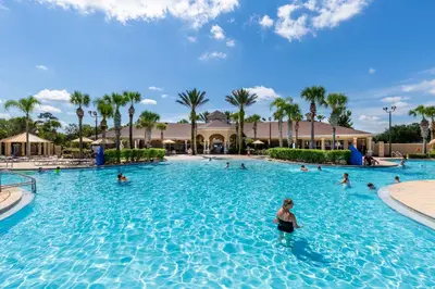 a group of people in a swimming pool at a resort at Magical Adventure Condo w Waterpark near Disney No Resort Fees in Orlando
