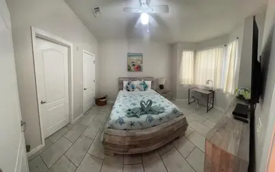 a bedroom with a large bed in a room at LUXURY and VINTAGE space to enjoy your vacation!! in Kissimmee